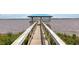A walk down the wooden pier featuring views of the waterway and a charming gazebo at the end at 2609 Seaport Circle, Georgetown, SC 29440