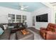 Comfortable sunroom with large windows, ceiling fan, and cozy seating at 2609 Seaport Circle, Georgetown, SC 29440