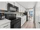 Modern kitchen with stainless steel appliances, white cabinets, and a dining area with ocean views at 3000 N Ocean Blvd. N # 531, Myrtle Beach, SC 29577