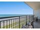 Balcony view overlooking the beach with metal railing and outdoor seating at 3000 N Ocean Blvd. N # 708, Myrtle Beach, SC 29577