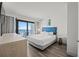 Bright bedroom boasts balcony access, contemporary furnishings and ocean views at 3000 N Ocean Blvd. N # 708, Myrtle Beach, SC 29577