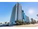 Exterior view of condo building showing balcony views and beach access at 3000 N Ocean Blvd. N # 708, Myrtle Beach, SC 29577