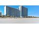Oceanfront condominiums with balconies and an expansive sandy beach landscape at 3000 N Ocean Blvd. N # 708, Myrtle Beach, SC 29577