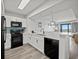 Modern kitchen with updated appliances and views of the living area at 3000 N Ocean Blvd. N # 708, Myrtle Beach, SC 29577