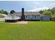 Expansive backyard featuring a wooden deck, patio, storage shed, and a lush green lawn at 302 Silver Fox Trail, Myrtle Beach, SC 29588