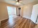 A bedroom that features wood-grain flooring, ceiling fan, and two closets at 302 Silver Fox Trail, Myrtle Beach, SC 29588