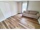 Bright bedroom featuring a couch, large window and spacious closet at 302 Silver Fox Trail, Myrtle Beach, SC 29588