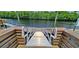 Boat dock with ramp leading down to water with surrounding trees at 302 Silver Fox Trail, Myrtle Beach, SC 29588