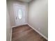 Welcoming entryway featuring a white front door with decorative glass and wood-look floors at 302 Silver Fox Trail, Myrtle Beach, SC 29588