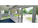 Inviting screened-in front porch offering a glimpse of the neighborhood and outdoor living at 302 Silver Fox Trail, Myrtle Beach, SC 29588