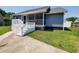 Charming home featuring a screened front porch and a well-manicured lawn for curb appeal at 302 Silver Fox Trail, Myrtle Beach, SC 29588