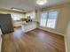 Eat-in kitchen features white cabinets, grey appliances, and a breakfast bar at 302 Silver Fox Trail, Myrtle Beach, SC 29588