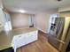 Open kitchen features modern stainless steel refrigerator and updated countertops at 302 Silver Fox Trail, Myrtle Beach, SC 29588