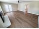 Bright living room with wood-look floors and French doors leading to the outdoor space at 302 Silver Fox Trail, Myrtle Beach, SC 29588