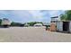 Property with various boats parked in a gravel lot with industrial containers and equipment at 302 Silver Fox Trail, Myrtle Beach, SC 29588