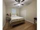 Neutral bedroom with a bed, ceiling fan, and closet, offering a calm and relaxing space at 304 S Magnolia Ave., Andrews, SC 29510