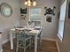 Bright dining room featuring a white table, stylish seating, and tasteful wall decorations at 304 S Magnolia Ave., Andrews, SC 29510