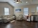 Open concept living room featuring a comfortable sofa, vaulted ceiling, and views to the kitchen at 304 S Magnolia Ave., Andrews, SC 29510