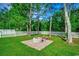 Beautiful backyard with a stone fire pit in a fenced yard with mature trees at 3129 Slade Dr., Conway, SC 29526