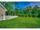 A well-maintained lawn and white picket fence can be seen in this backyard at 3129 Slade Dr., Conway, SC 29526
