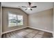 This bedroom has hardwood floors, neutral paint, and a vaulted ceiling for optimal comfort at 3129 Slade Dr., Conway, SC 29526