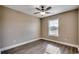 This bedroom boasts hardwood floors, neutral paint, and a ceiling fan for optimal comfort at 3129 Slade Dr., Conway, SC 29526