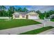 Exterior view of a home with a two-car garage, manicured lawn and a paved driveway at 3129 Slade Dr., Conway, SC 29526