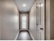 Bright hallway with dark wood floors leading to a door with decorative glass at 3129 Slade Dr., Conway, SC 29526