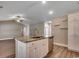 Open-concept kitchen featuring island seating, stainless steel appliances, and wood flooring at 3129 Slade Dr., Conway, SC 29526