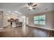 Open-concept living room with vaulted ceiling, hardwood floors, and bright, natural light at 3129 Slade Dr., Conway, SC 29526