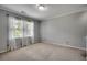 Cozy bedroom with carpet, a large window, and white curtains for a bright and airy feel at 3334 Cedar Creek Run, Little River, SC 29566
