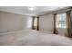 Neutral bedroom with carpet and two windows offering natural light at 3334 Cedar Creek Run, Little River, SC 29566