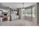 Bright dining area with built-ins, tile floors, and views to living room at 3334 Cedar Creek Run, Little River, SC 29566