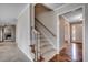 Welcoming entryway featuring hardwood floors, carpeted stairs, and classic trim details at 3334 Cedar Creek Run, Little River, SC 29566