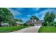 Charming two-story brick home with a well-manicured lawn and attached two-car garage at 3334 Cedar Creek Run, Little River, SC 29566