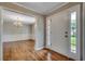 Inviting foyer features hardwood floors, sidelights, and a view to the formal dining room at 3334 Cedar Creek Run, Little River, SC 29566