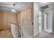 Upstairs hallway featuring a decorative light fixture and access to multiple rooms at 3334 Cedar Creek Run, Little River, SC 29566