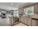 Well-lit kitchen with stainless steel appliances, tile backsplash, and open layout at 3334 Cedar Creek Run, Little River, SC 29566