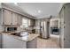 Modern kitchen with granite countertops, stainless steel appliances, and tile floors at 3334 Cedar Creek Run, Little River, SC 29566