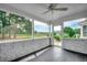 Enclosed porch with serene golf course views and a ceiling fan at 3334 Cedar Creek Run, Little River, SC 29566