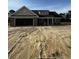 New construction brick home with a two car garage, and unfinished landscaping at 3444 Asbury Rd., Aynor, SC 29511