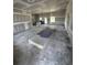 Spacious living room undergoing construction with new drywall and large windows at 3444 Asbury Rd., Aynor, SC 29511