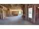 Unfinished home interior with wood framing and large windows, offering a spacious layout and natural light at 3530 Good Luck Rd., Aynor, SC 29511