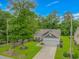 Aerial view of a single-Gathering home with driveway, garage, and lawn at 3539 Harrelson Ave., Loris, SC 29569