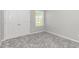 Cozy bedroom with neutral paint, plush carpet, a window, and closet for ample storage at 3539 Harrelson Ave., Loris, SC 29569
