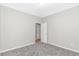 Neutral-toned bedroom offering space with ample storage via closet, neutral carpet, and ensuite access at 3539 Harrelson Ave., Loris, SC 29569