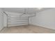 Spacious garage with concrete floor and white garage door with opener at 3539 Harrelson Ave., Loris, SC 29569