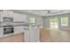 Charming kitchen featuring stainless steel appliances, a granite countertop, and a breakfast bar area at 3539 Harrelson Ave., Loris, SC 29569