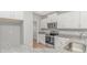 Modern kitchen featuring stainless steel appliances, granite countertops, and white cabinetry at 3539 Harrelson Ave., Loris, SC 29569