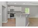 Modern kitchen featuring stainless steel appliances, granite countertops, and white cabinetry at 3539 Harrelson Ave., Loris, SC 29569